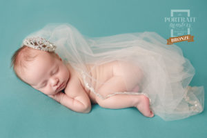 An image showcasing an award-winning picture of a newborn baby created by Joanna Booth of Joanna Booth Photography in Katy Texas.