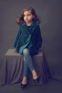 A portrait of a child posing for Sanguine Portraiture by Joanna Booth of Joanna Booth Photography in Katy Texas.